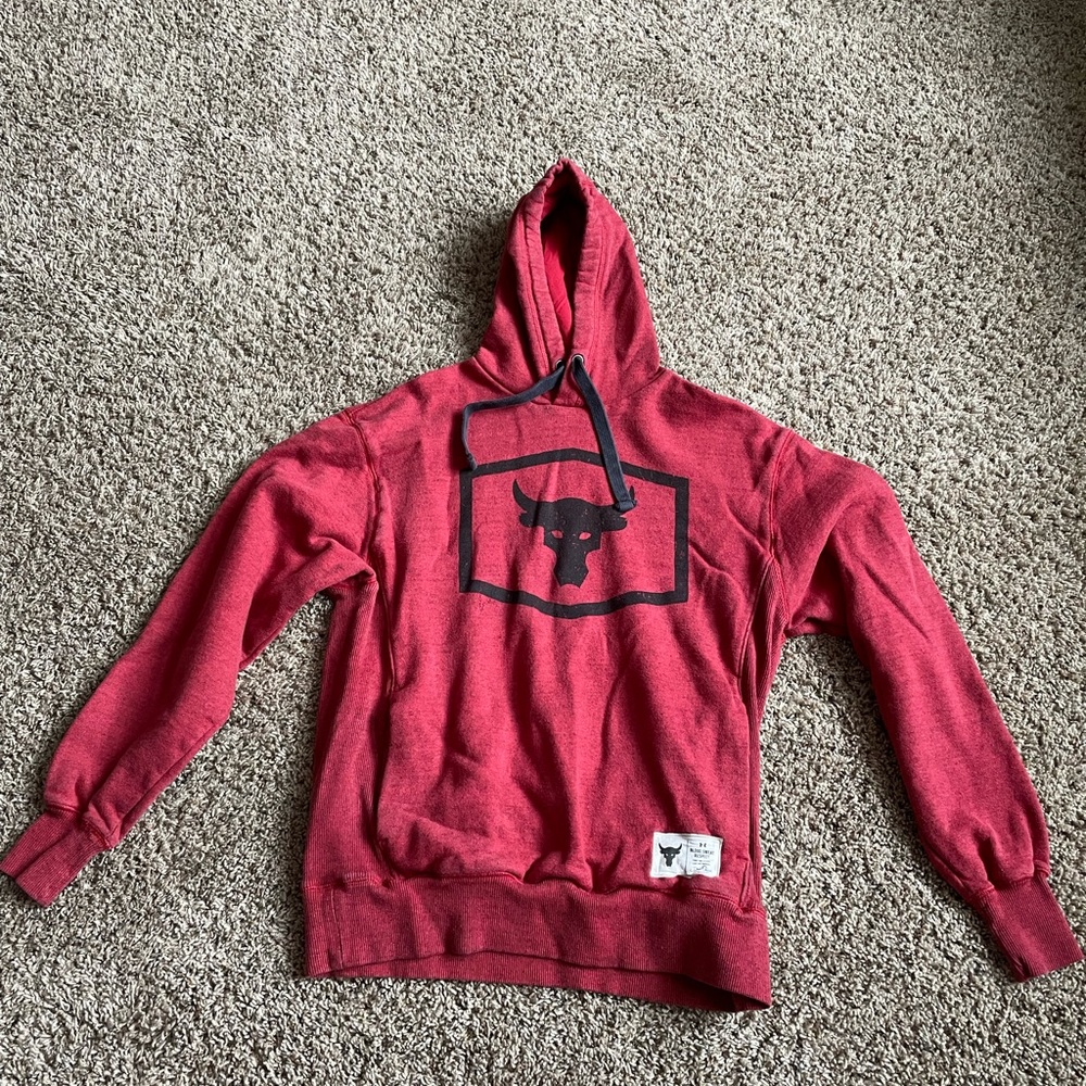 Men’s medium under Armour project rock hooded red sweatshirt.